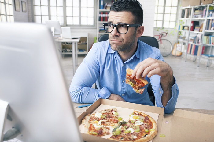 Packing On The Pounds: 44% Of Workers Gaining Weight On The Job